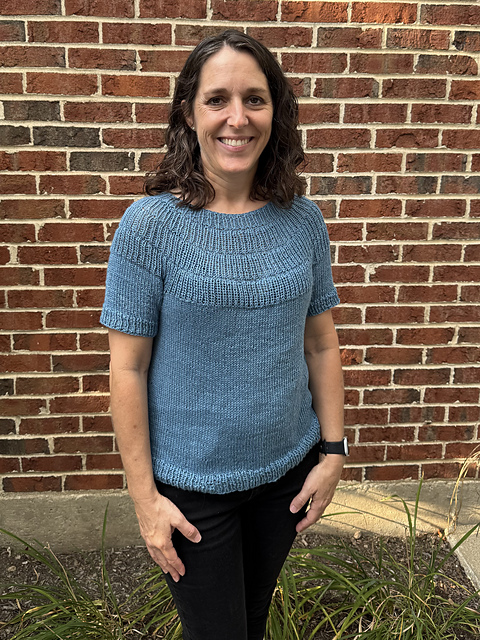 Jessie, founder of White Branch Knits, wearing a handknit top